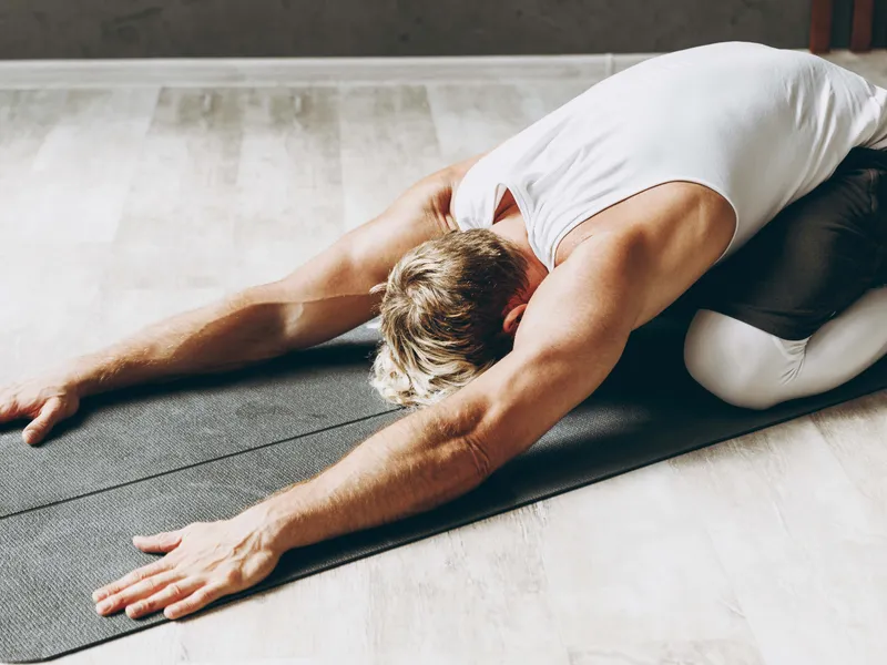 Athlete performing dynamic recovery exercises